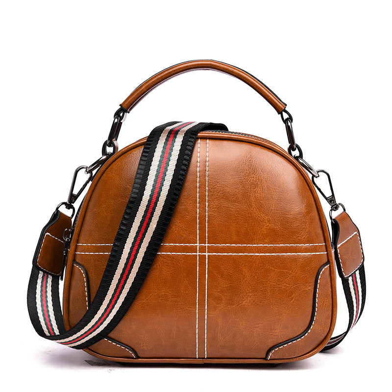 Versatile stitching handbag