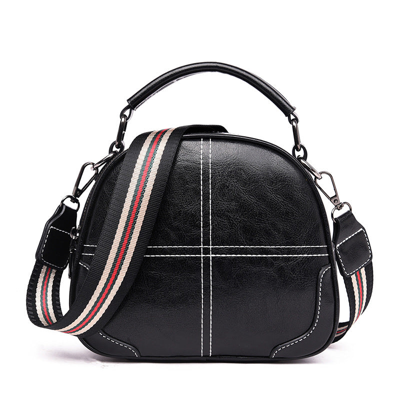 Versatile stitching handbag