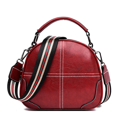 Versatile stitching handbag