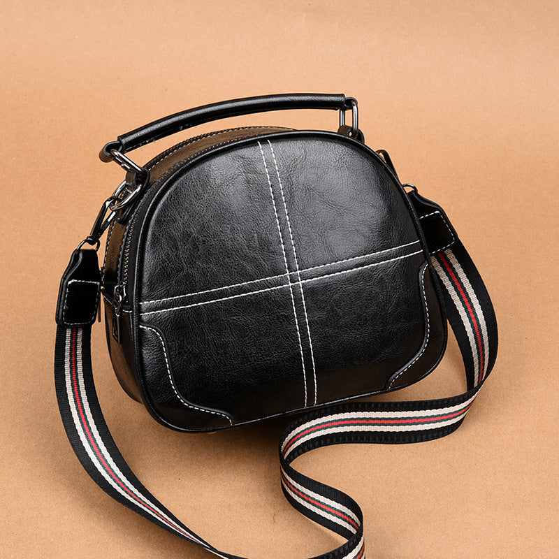 Versatile stitching handbag